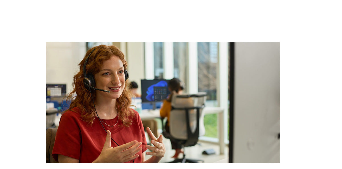 Professional using an HP Poly headset while speaking during a workplace call