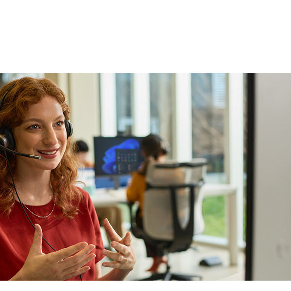 Professional using an HP Poly headset while speaking during a workplace call