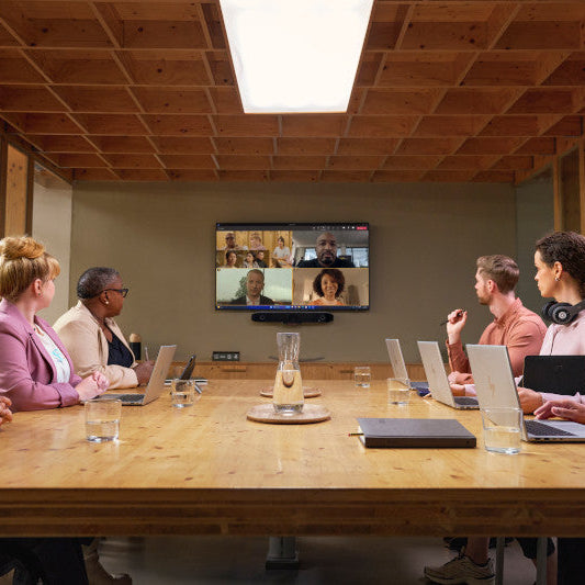  Poly DirectorAI smart framing improving hybrid meeting collaboration.