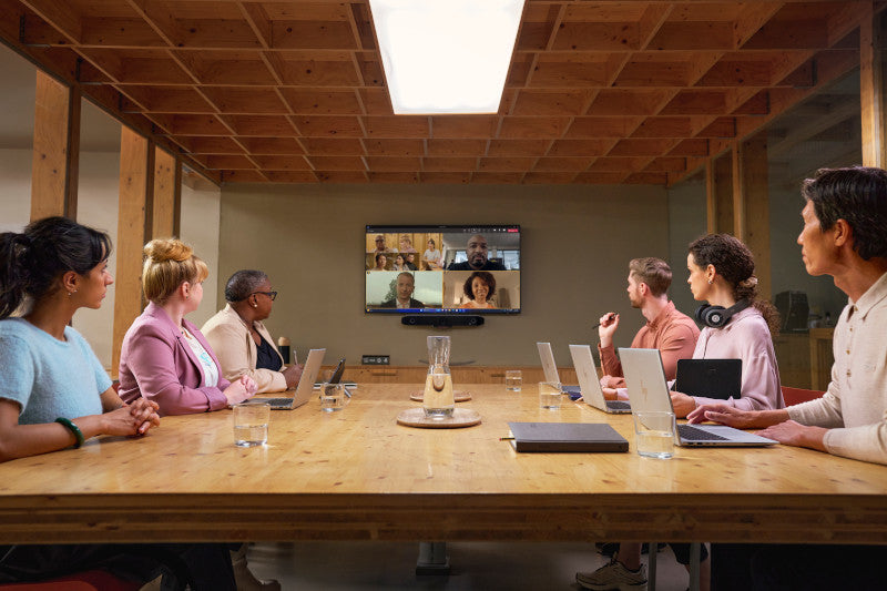  Poly DirectorAI smart framing improving hybrid meeting collaboration.