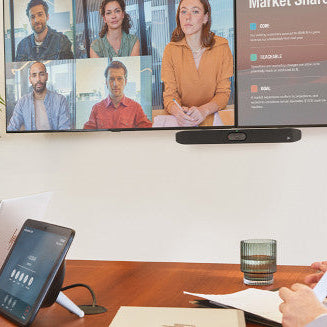 Small meeting room using the Poly Studio X32 video bar for hybrid video conferencing and collaboration.