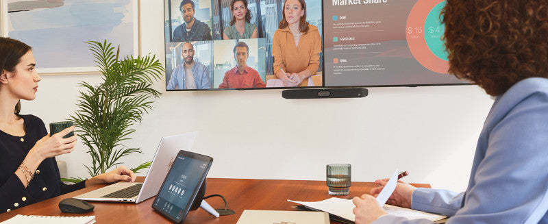 Small meeting room using the Poly Studio X32 video bar for hybrid video conferencing and collaboration.