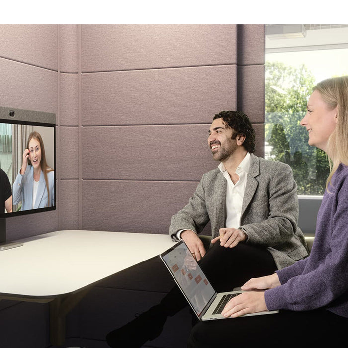 Employees viewing content on a Neat Board 32-inch display in a workplace setting
